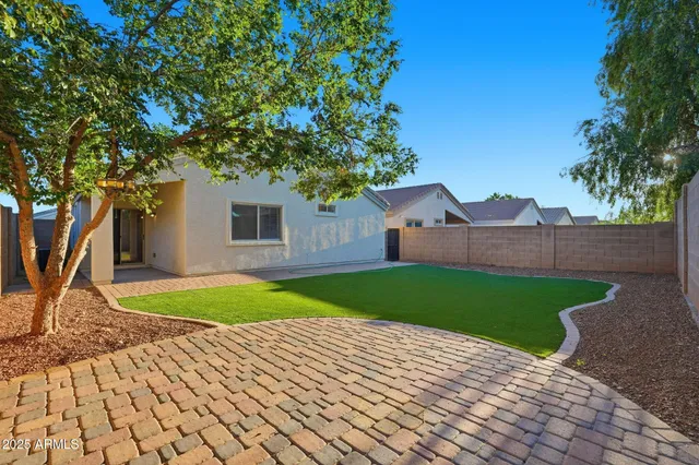 a view of a backyard of the house