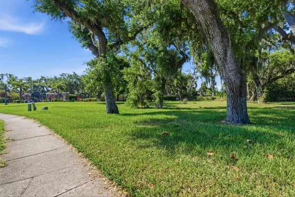 a view of a lake with houses in the back