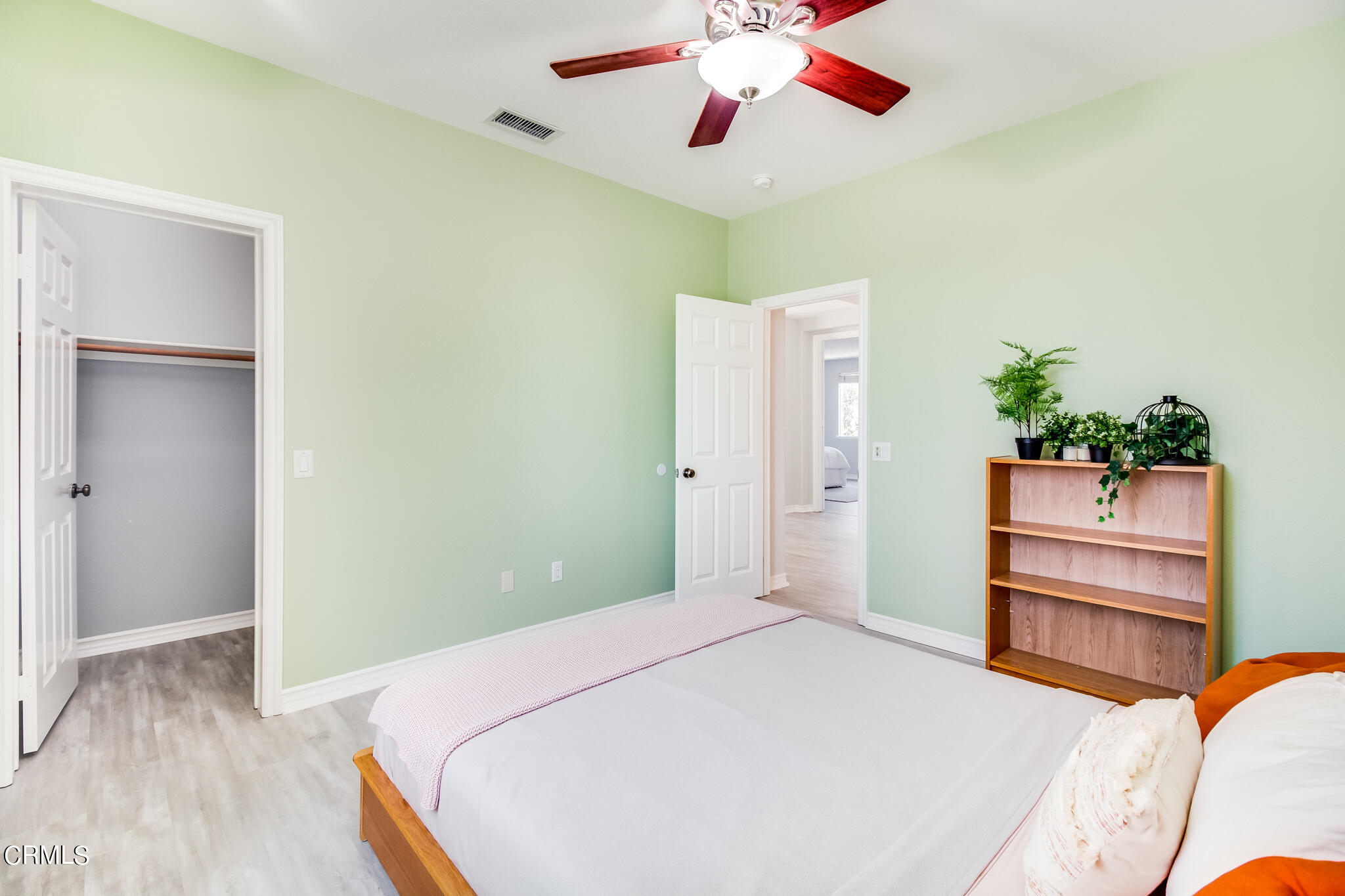 13625 Silver Oak Lane Moorpark, CA 93021 - Photo 23 of 44 a bedroom with a bed and a chandelier