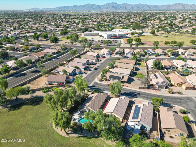 an aerial view of residential houses with outdoor space
