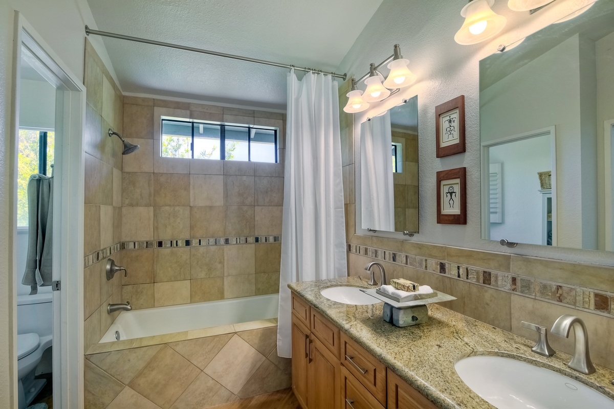 1501 Del Mar Road Oceanside, CA 92057 - Photo 11 of 25 Granite Counters, Tiled Shower/Bath Combo, updated lighting