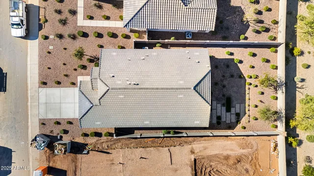 a kitchen with a refrigerator a sink dishwasher and white cabinets