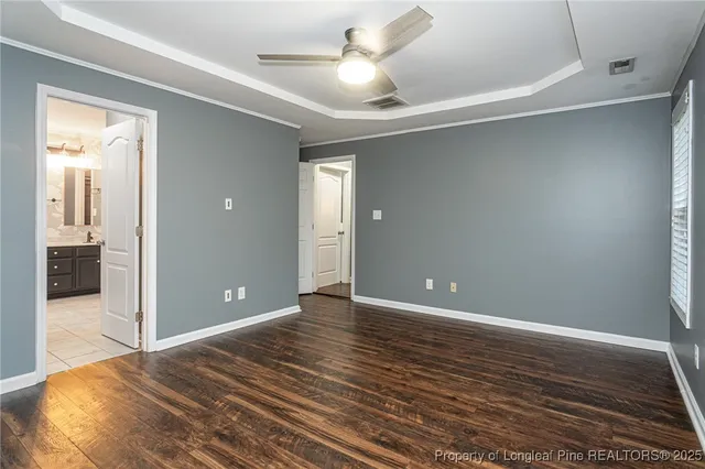 a view of room with window and ceiling fan