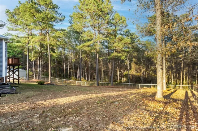a backyard of a building with trees