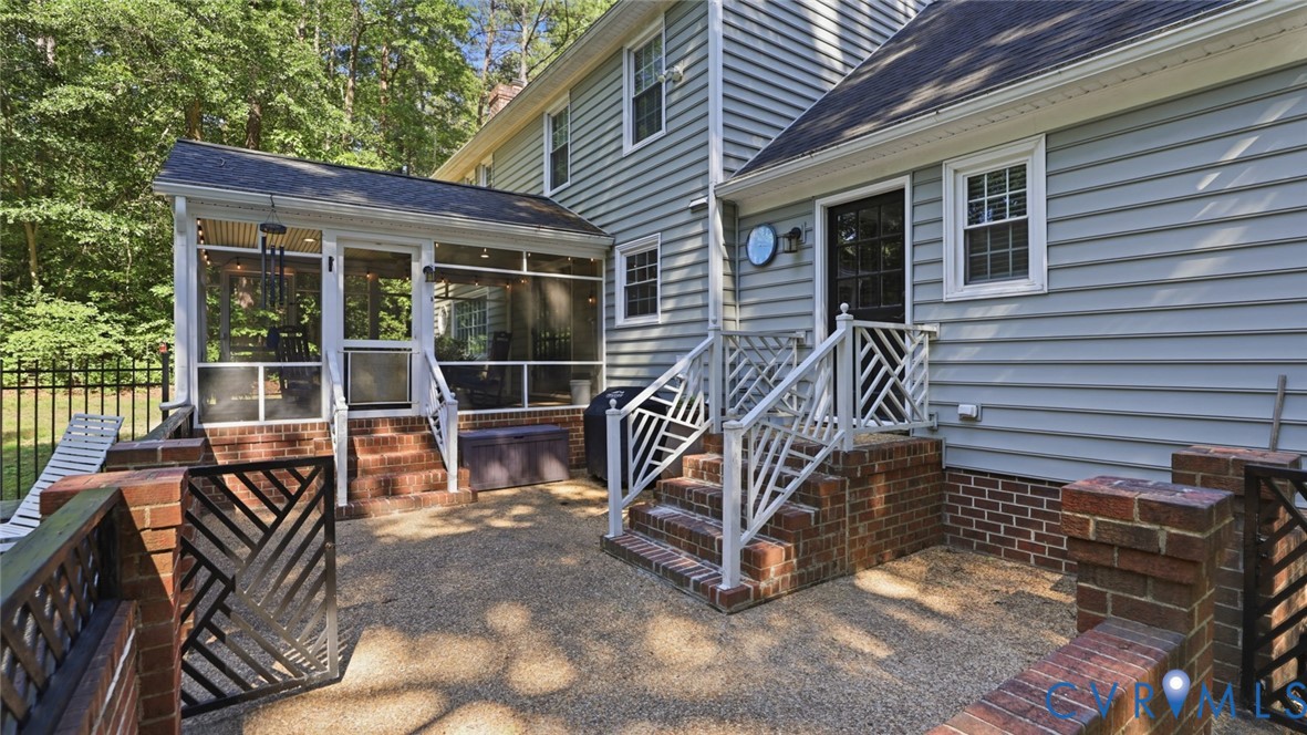 10716 Chalkley Road Richmond, VA 23237 - Photo 39 of 46 a view of house with a large window and wooden fence