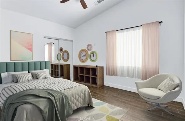 a bedroom with a bed and glass window