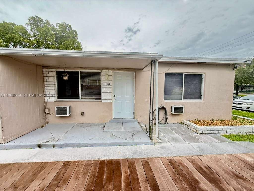 1049 Southwest 3rd Street Hallandale Beach, FL 33009 - Photo 1 of 15 a view of a living room and front door