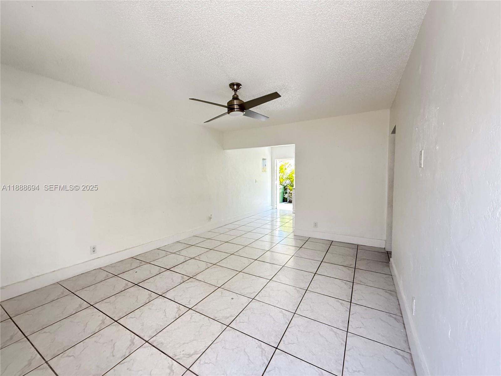 1049 Southwest 3rd Street Hallandale Beach, FL 33009 - Photo 5 of 15 a view of an empty room and window