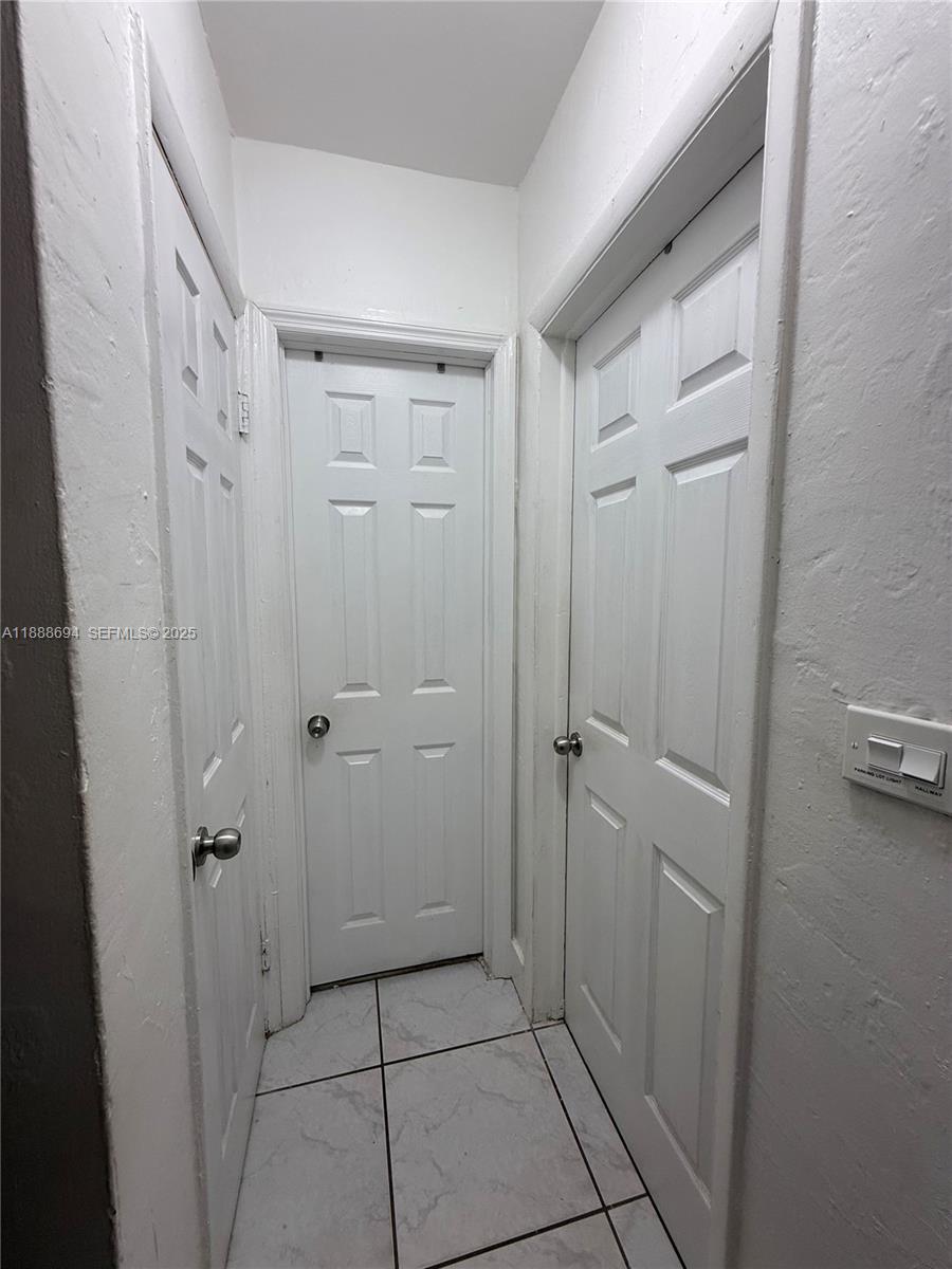 1049 Southwest 3rd Street Hallandale Beach, FL 33009 - Photo 8 of 15 a bathroom with a shower and a glass door