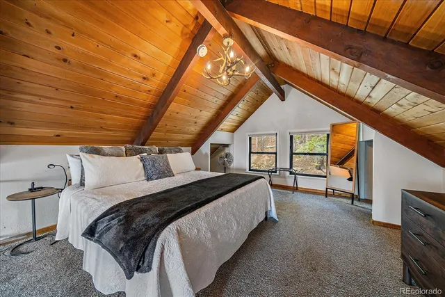 a bed room with a bed and a large window