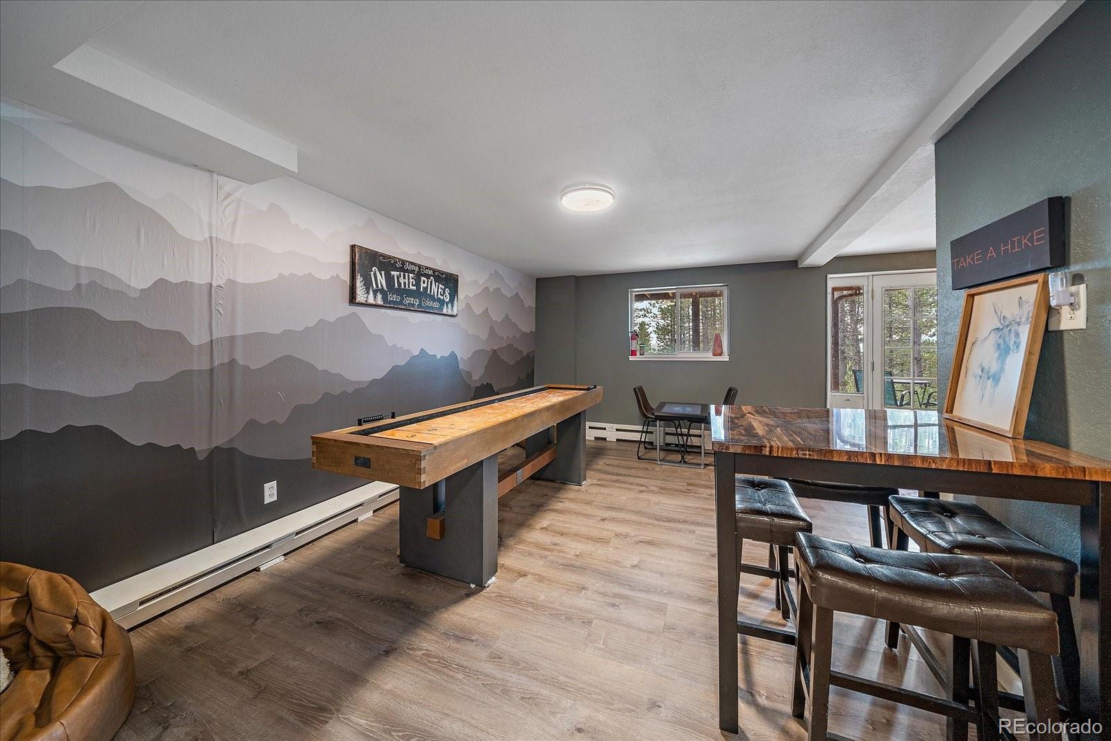 136 Nebraska Drive Idaho Springs, CO 80452 - Photo 22 of 29 a room with furniture pool table and windows