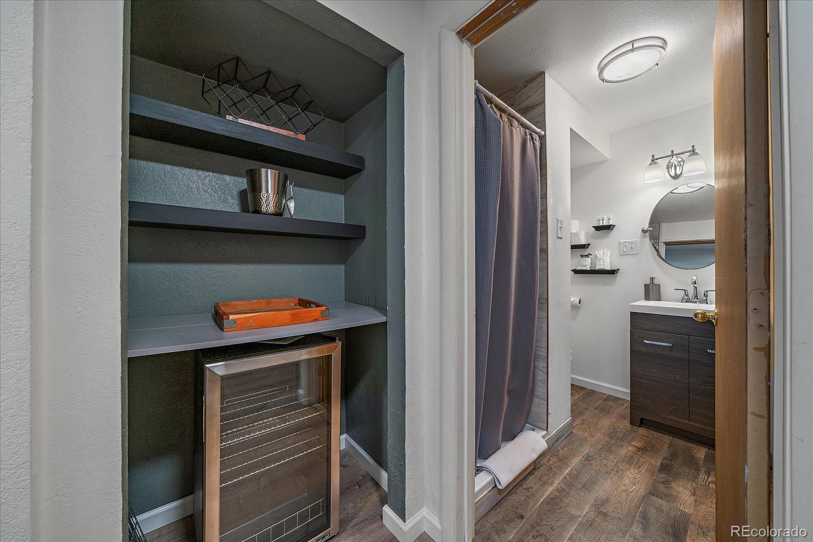 136 Nebraska Drive Idaho Springs, CO 80452 - Photo 24 of 29 a room that has a refrigerator and a stove