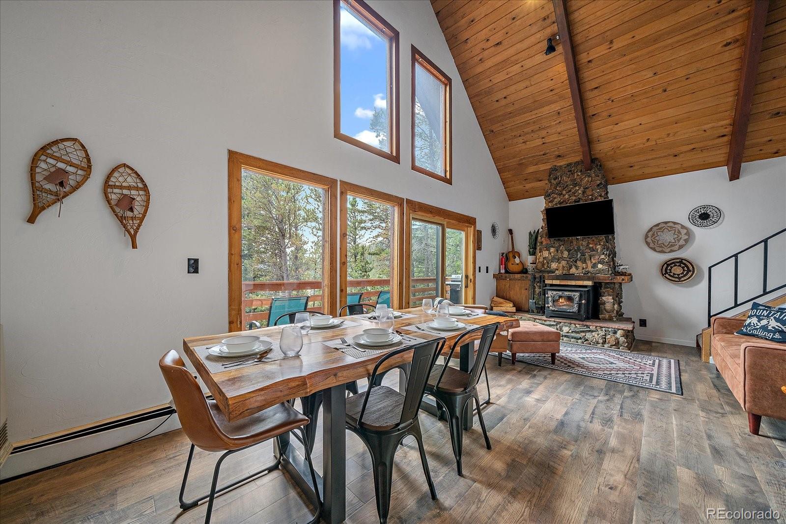136 Nebraska Drive Idaho Springs, CO 80452 - Photo 4 of 29 a view of a dining room with furniture window and outside view