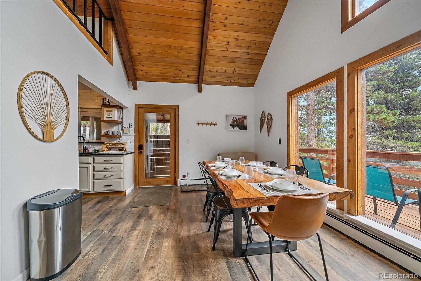 136 Nebraska Drive Idaho Springs, CO 80452 - Photo 8 of 29 a view of a dining room with furniture window and wooden floor