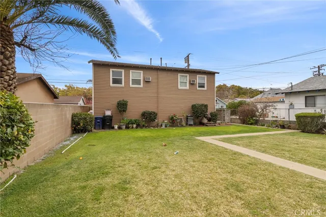 a view of a backyard of the house