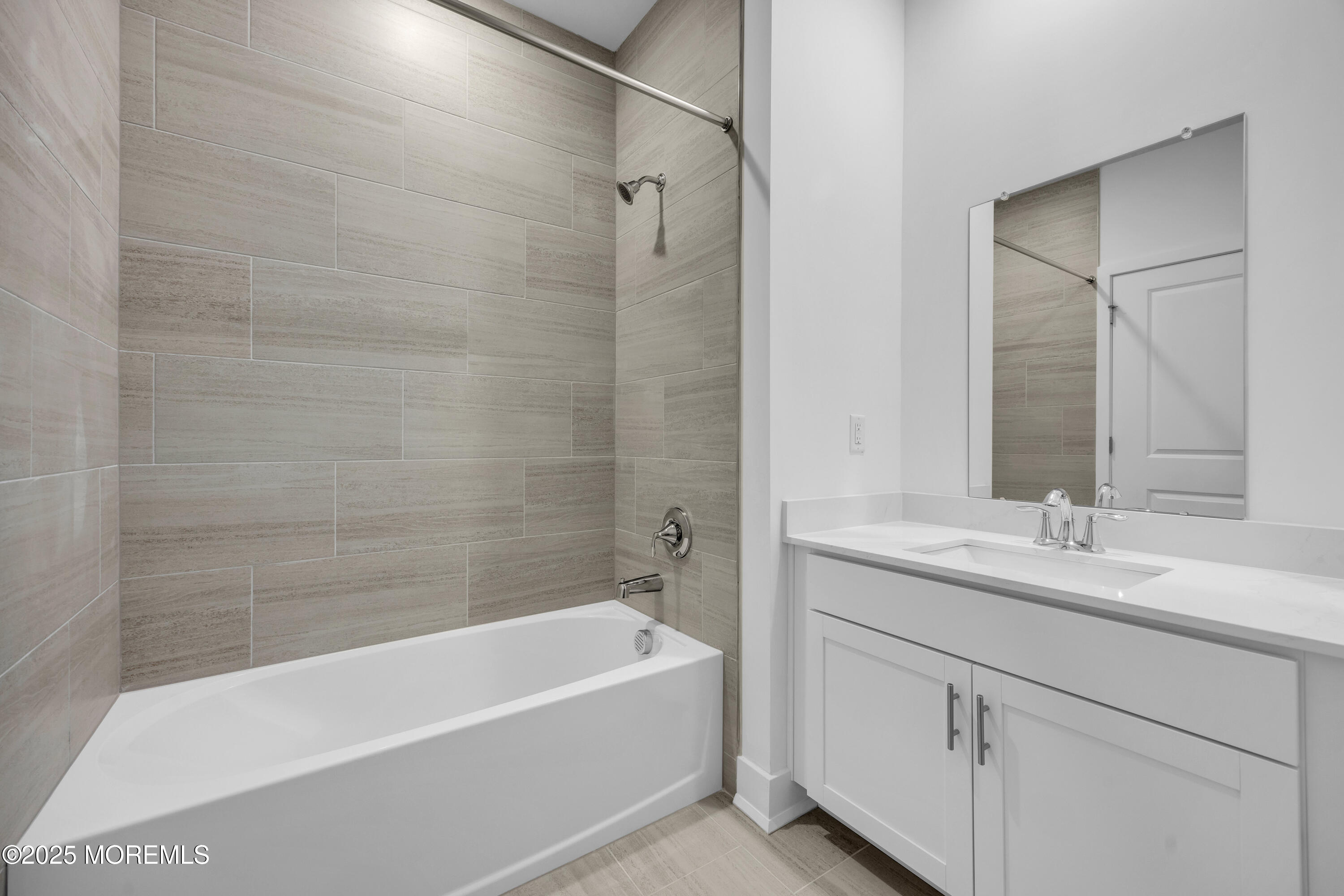 28311 Radford Court, Unit 2829 Monroe Township, NJ 08831 - Photo 20 of 29 a bathroom with a tub sink and mirror