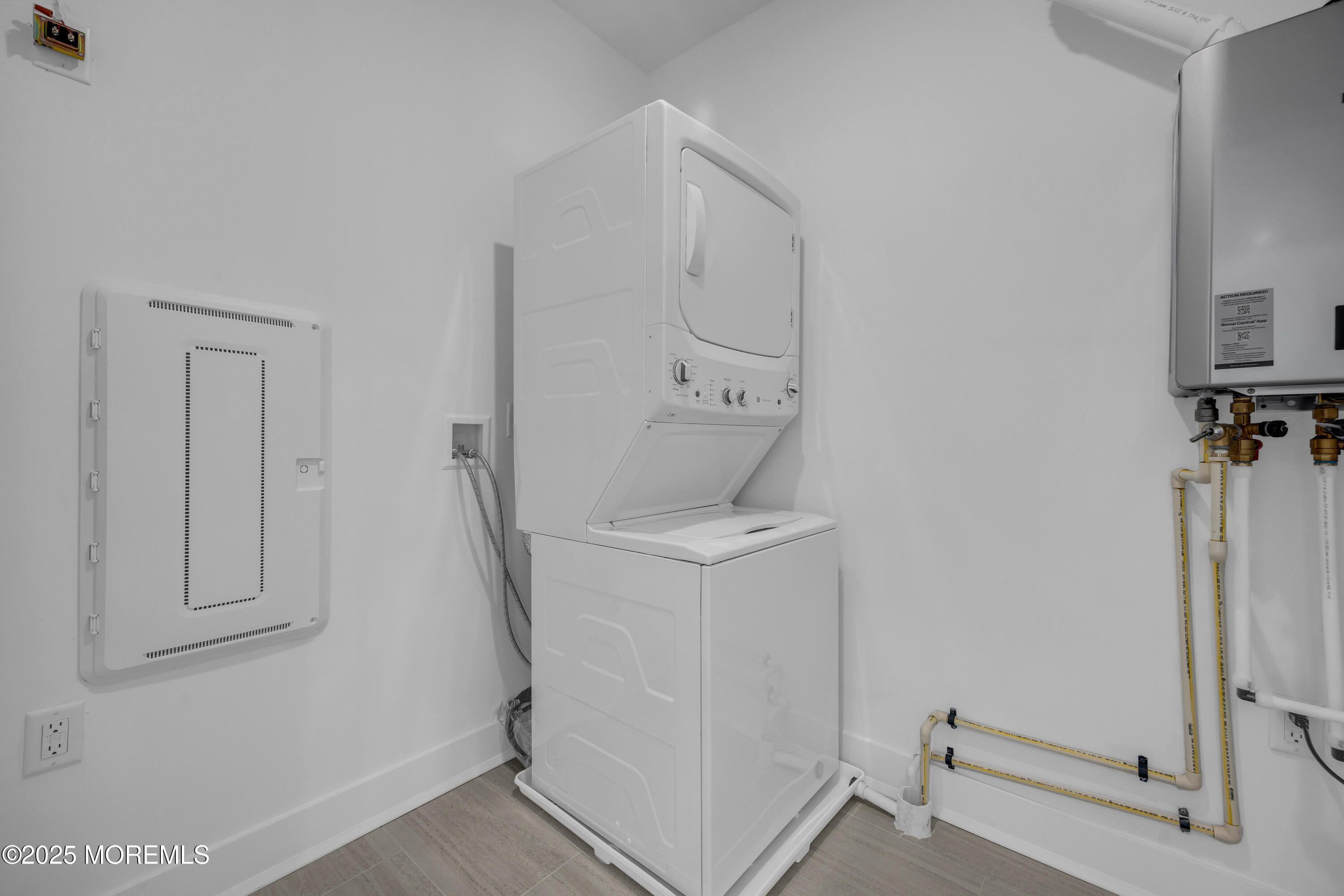 28311 Radford Court, Unit 2829 Monroe Township, NJ 08831 - Photo 21 of 29 a utility room with cabinets