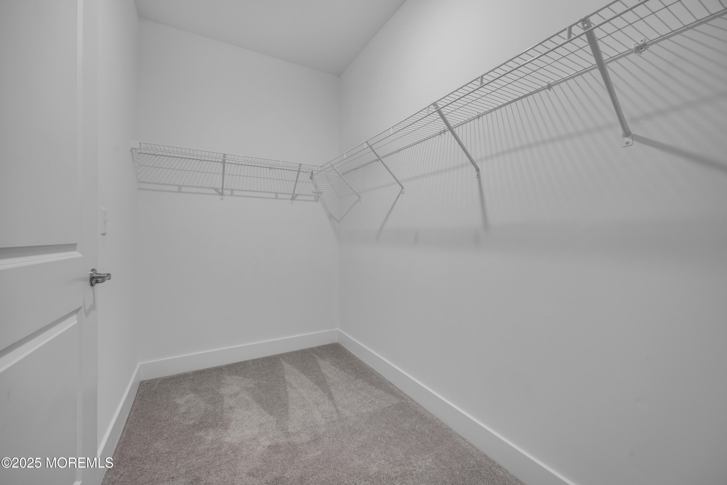 28311 Radford Court, Unit 2829 Monroe Township, NJ 08831 - Photo 26 of 29 a view of a room with racks on the wall