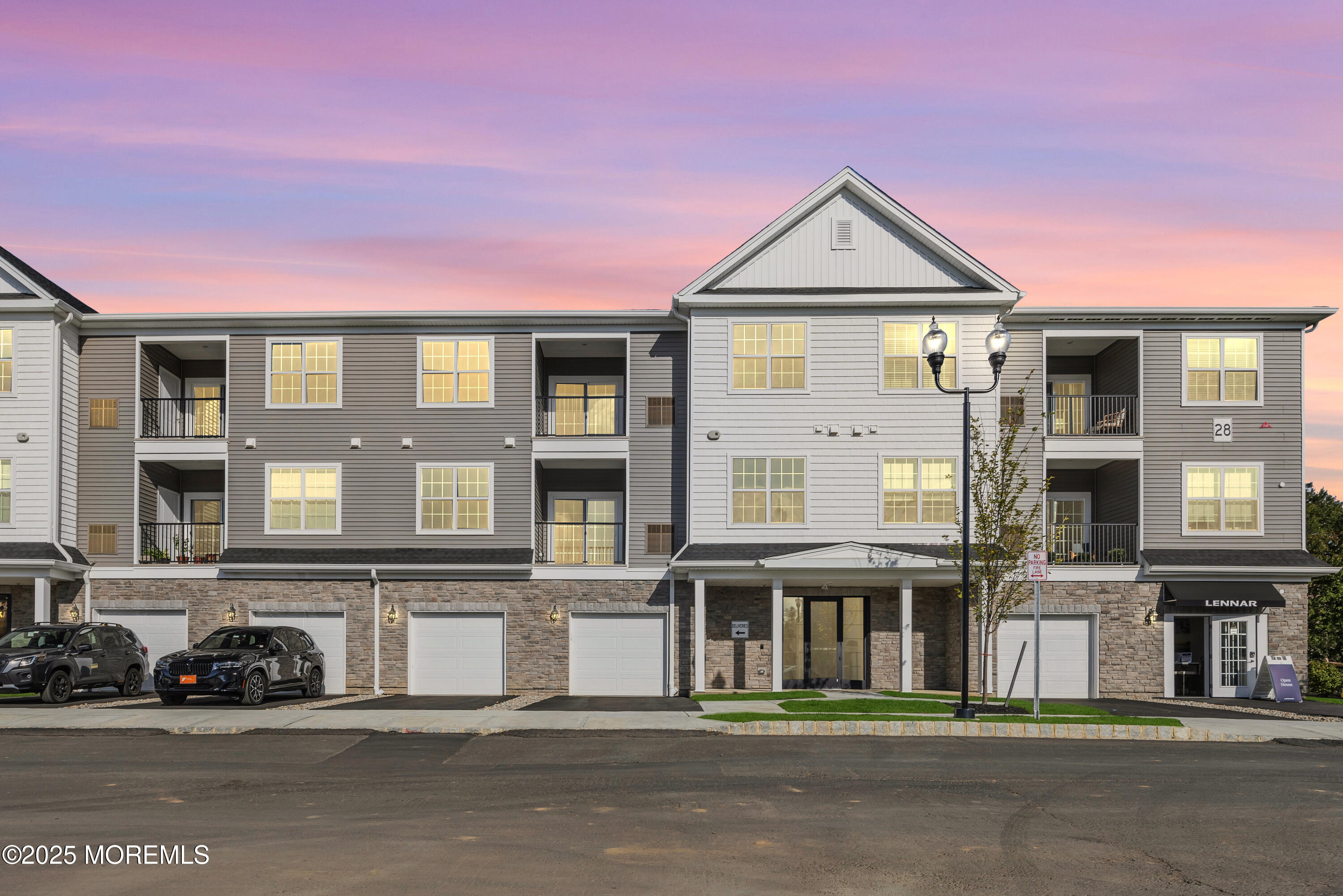 28311 Radford Court, Unit 2829 Monroe Township, NJ 08831 - Photo 3 of 29 a front view of a house with a yard