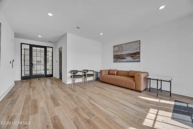 a view of a livingroom with furniture and wooden floor