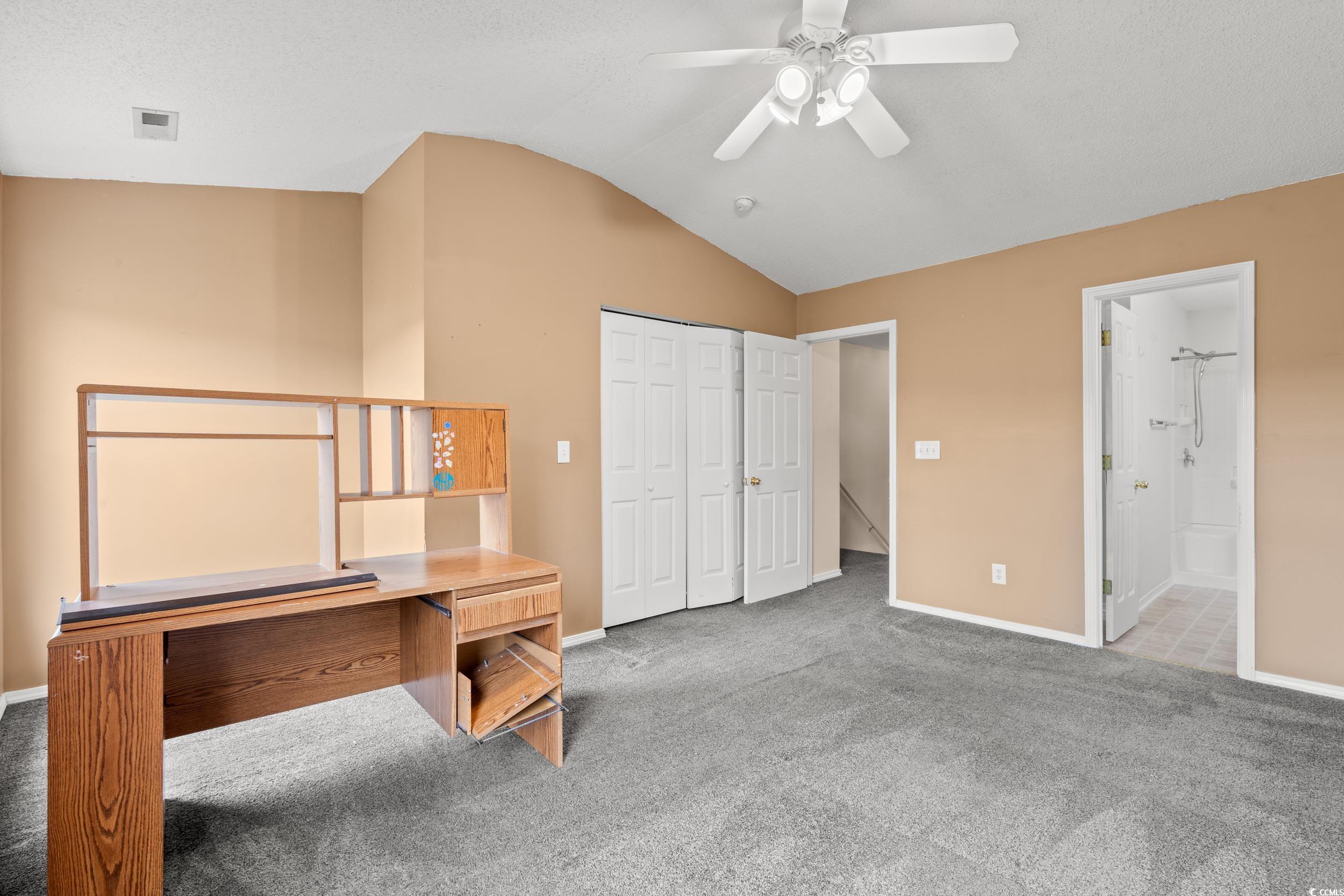 322 Kiskadee Loop, Unit 12E Conway, SC 29526 - Photo 13 of 36 Unfurnished office featuring carpet floors, vaulted ceiling, and ceiling fan