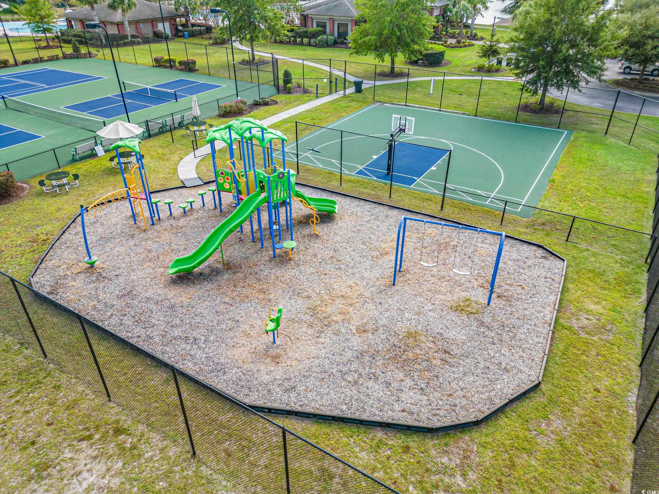322 Kiskadee Loop, Unit 12E Conway, SC 29526 - Photo 27 of 36 Community jungle gym featuring community basketball court