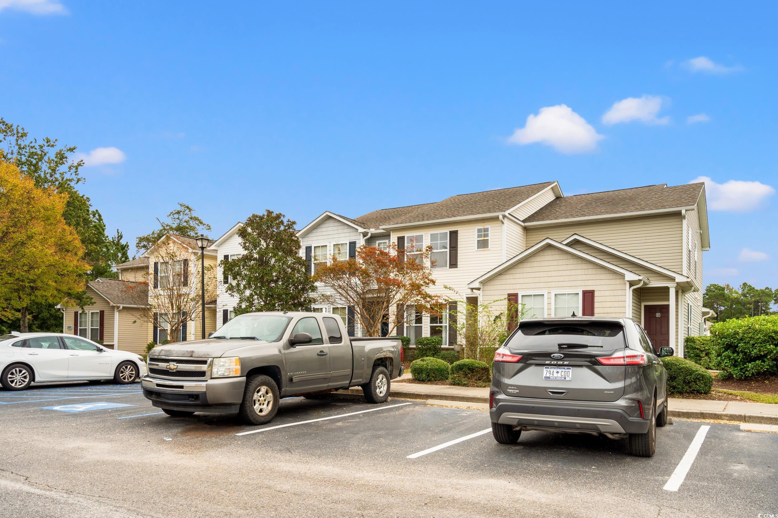 322 Kiskadee Loop, Unit 12E Conway, SC 29526 - Photo 3 of 36 View of front of home with uncovered parking