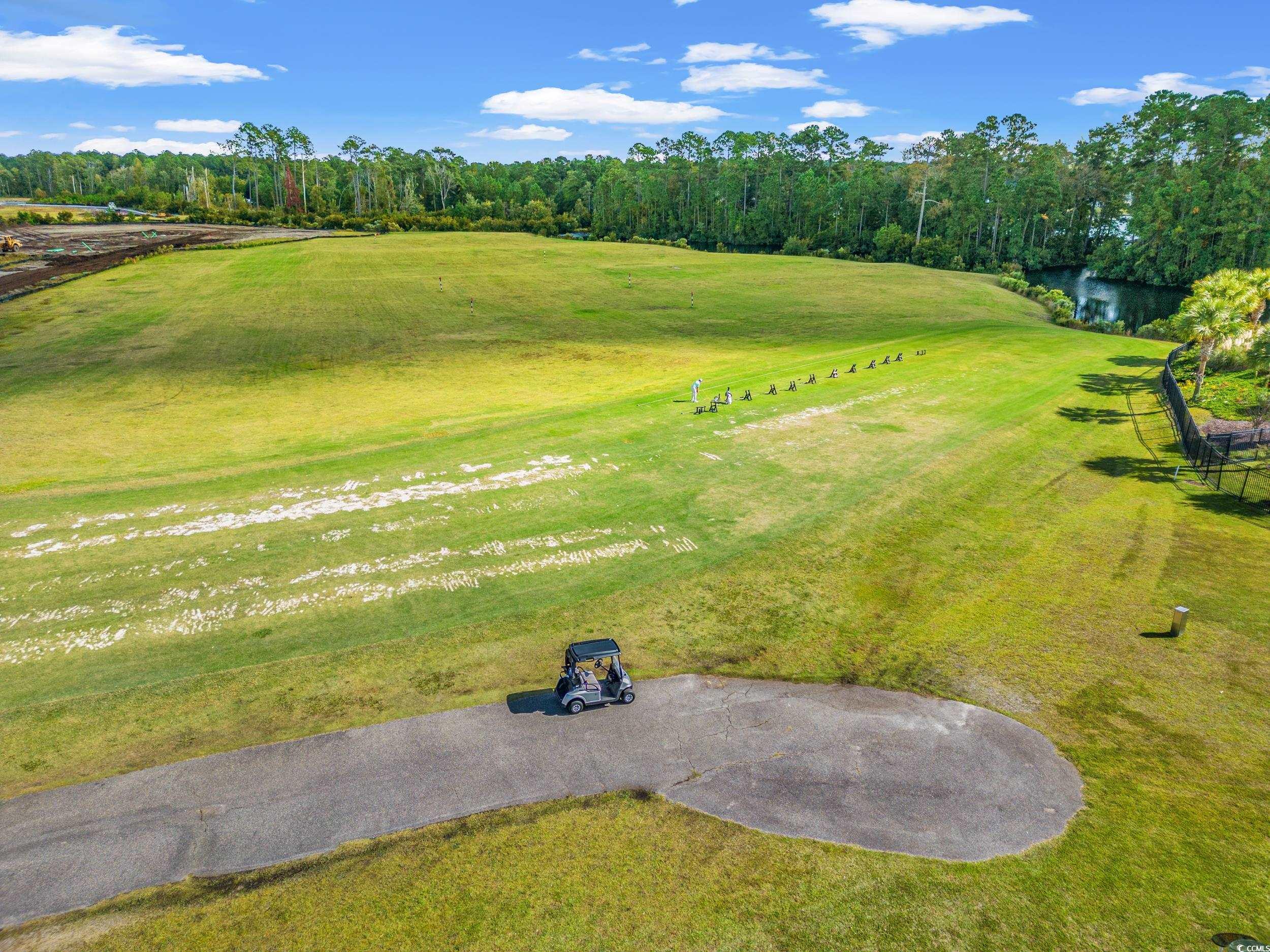 322 Kiskadee Loop, Unit 12E Conway, SC 29526 - Photo 31 of 36 Bird's eye view of a large body of water and a golf course