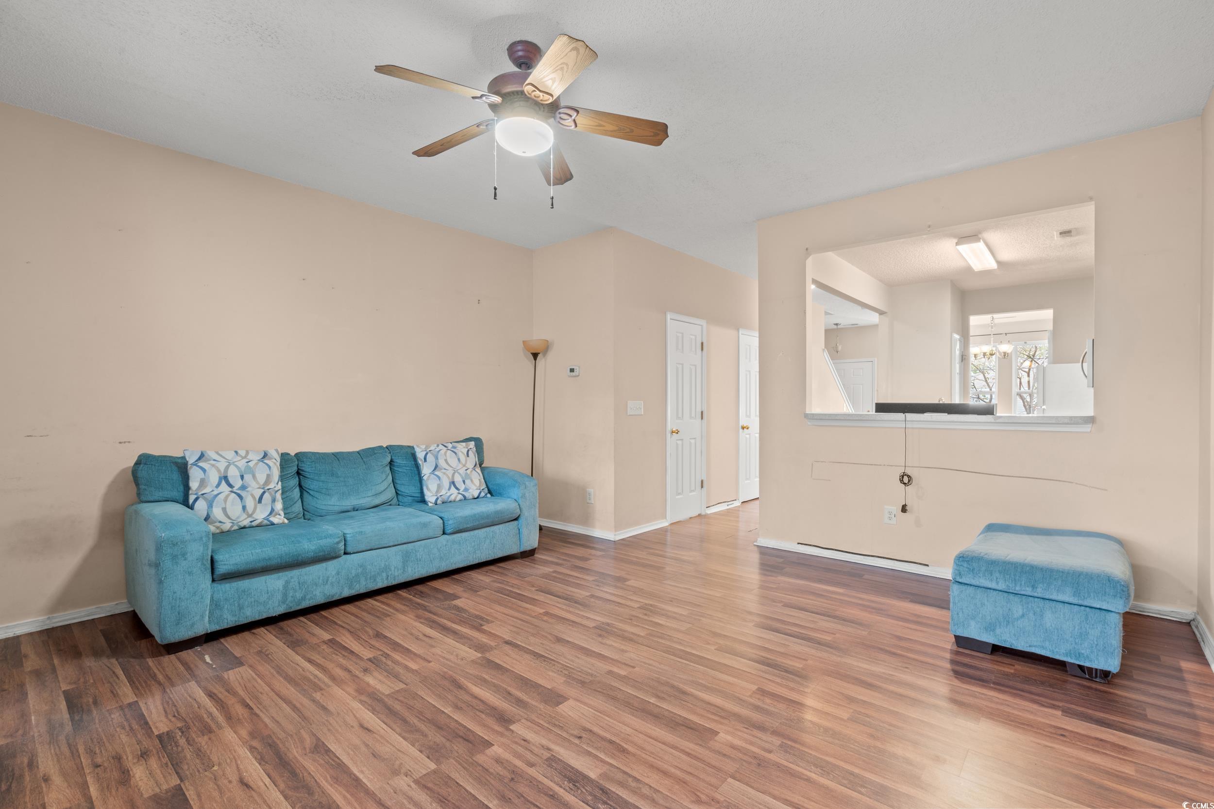 322 Kiskadee Loop, Unit 12E Conway, SC 29526 - Photo 7 of 36 Living room featuring wood finished floors and ceiling fan