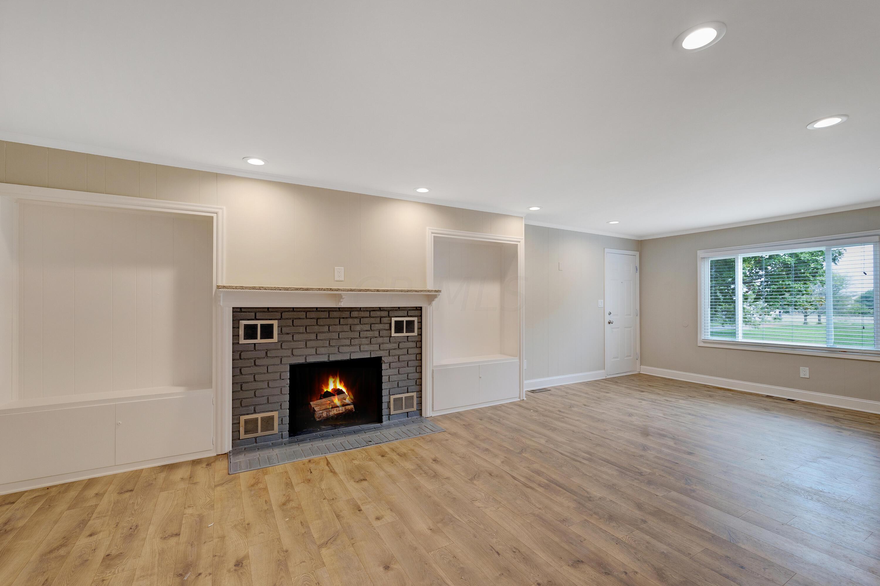 8119 South Old State Road Lewis Center, OH 43035 - Photo 9 of 50 Family room with wood-burning fireplace
