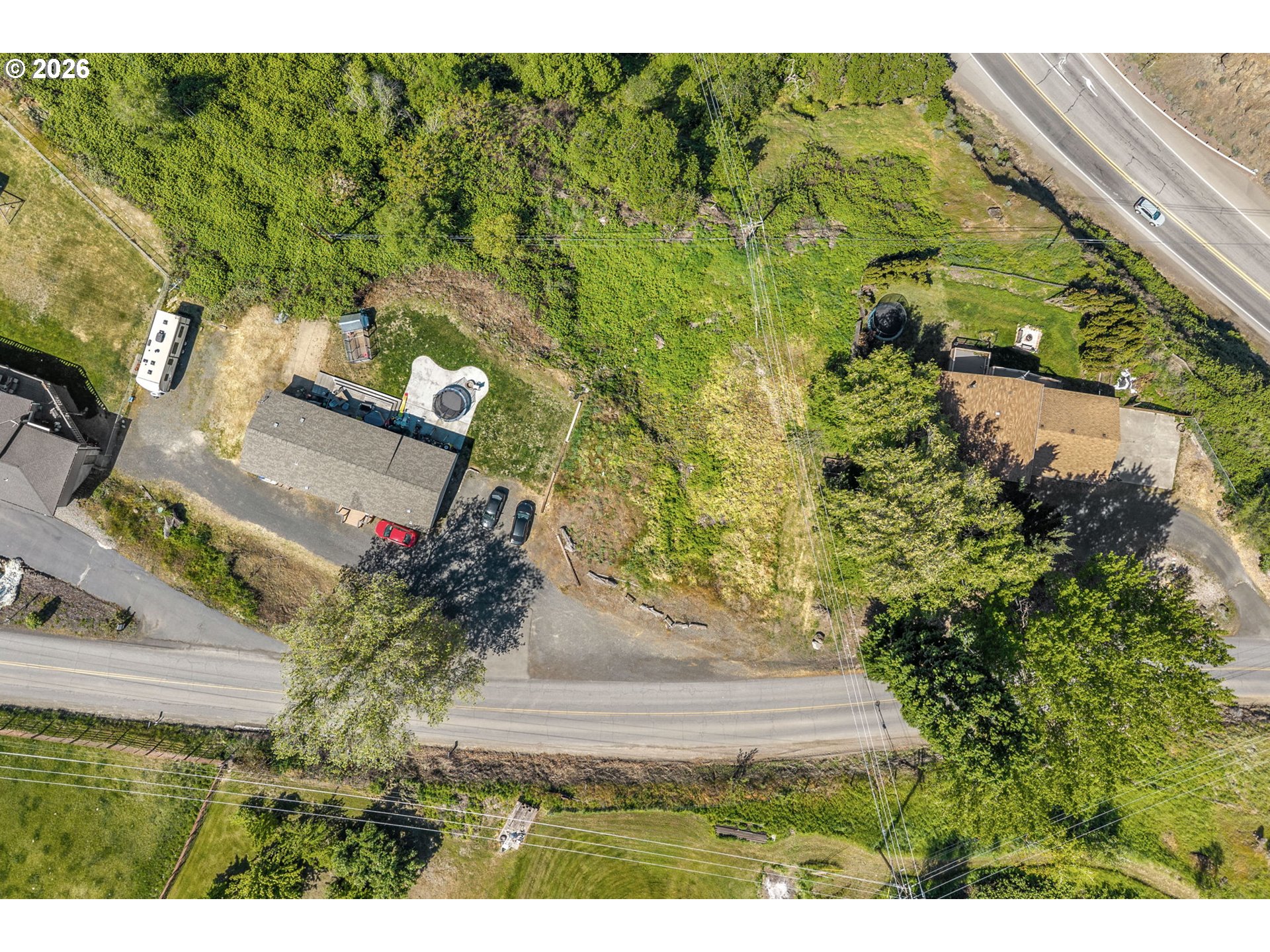 0 Fremont Street The Dalles, OR 97058 - Photo 3 of 16 a view of a yard with plants