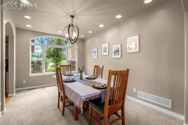 a view of a dining room with furniture window and outside view
