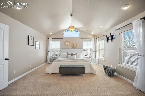 a bedroom with bed and a window