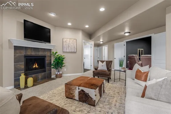 a living room with furniture and a flat screen tv