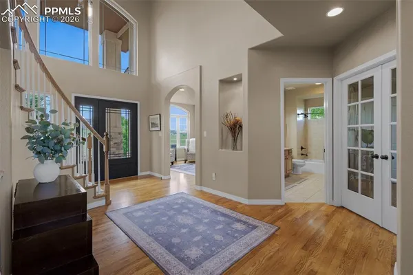 a living room with furniture rug and wooden floor