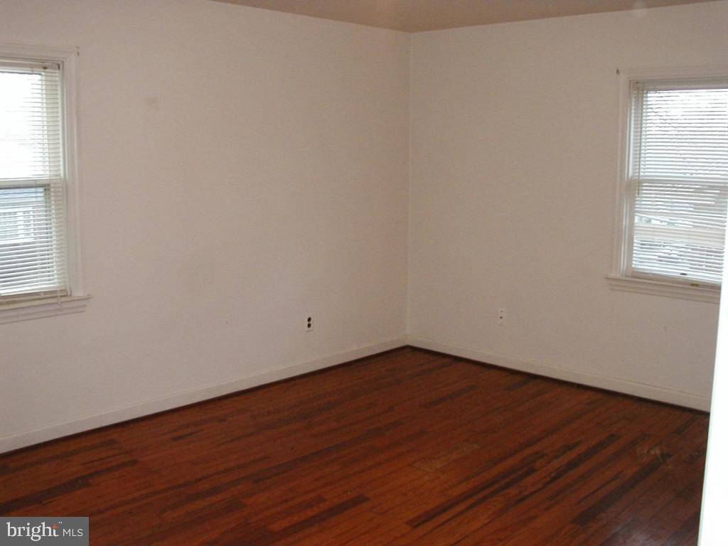 425 South Cedar Street Lititz, PA 17543 - Photo 8 of 16 an empty room with wooden floor and windows