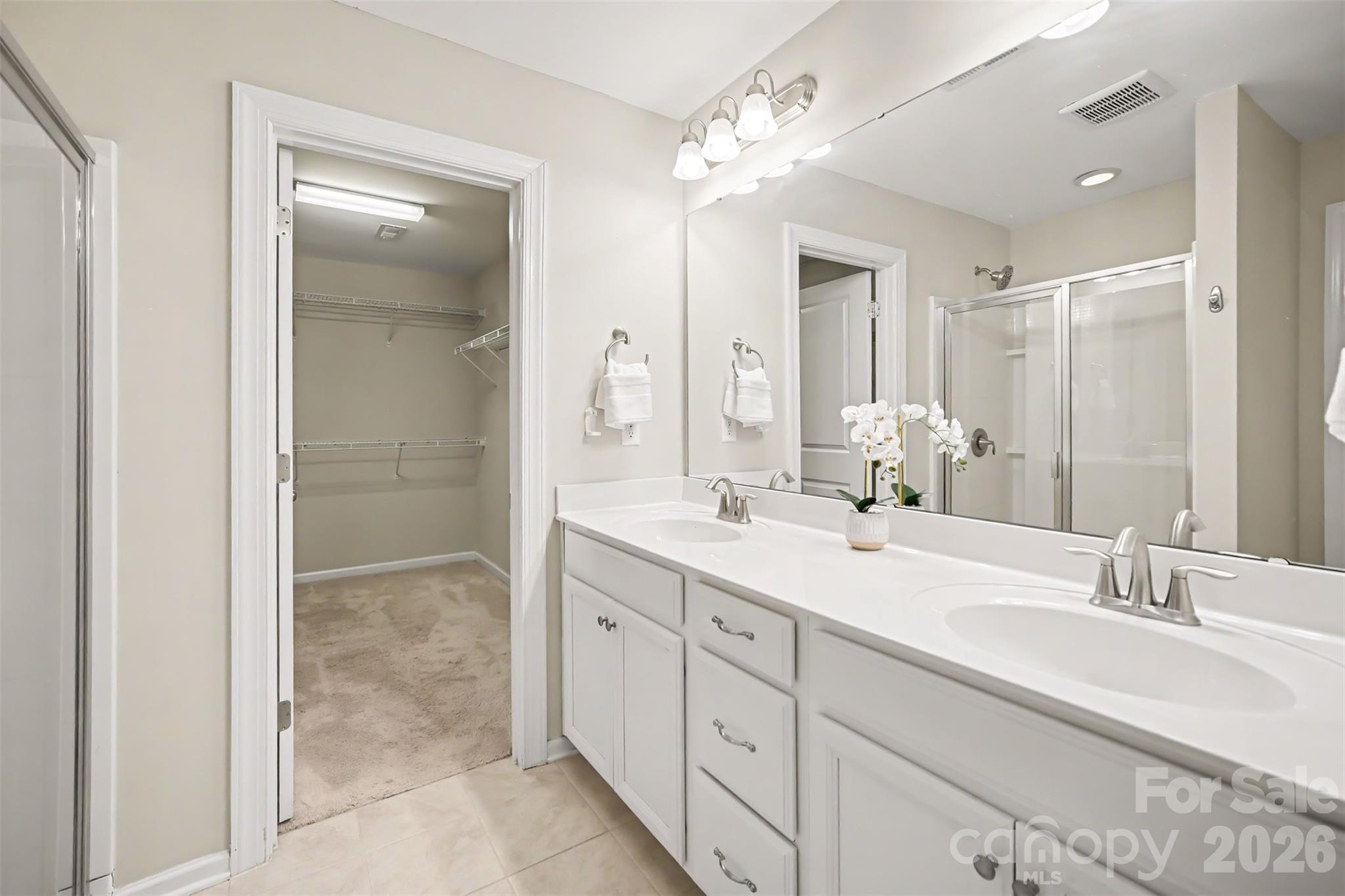 1029 Archibald Avenue Fort Mill, SC 29708 - Photo 20 of 45 a bathroom with double sink and a mirror