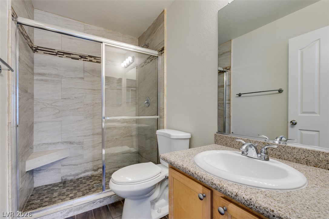 200 Luninborg Street Henderson, NV 89074 - Photo 38 of 40 A well-appointed bathroom features a spacious walk-in shower and an elegant vanity.