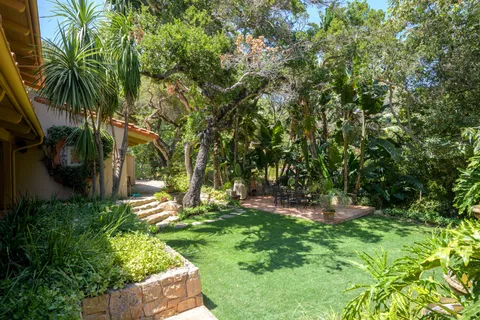 a backyard of a house with lots of green space