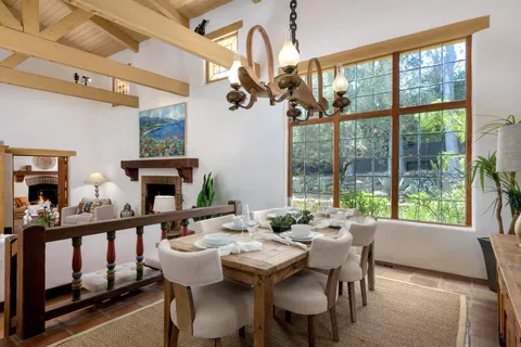 a view of a dining room with furniture window and outside view