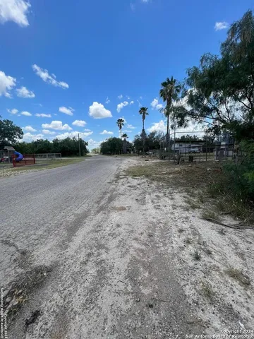 a view of a yard with sunset
