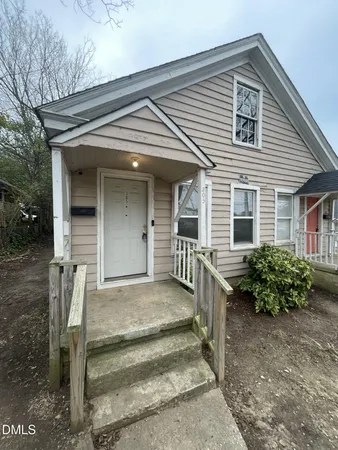 front view of a house with a small yard