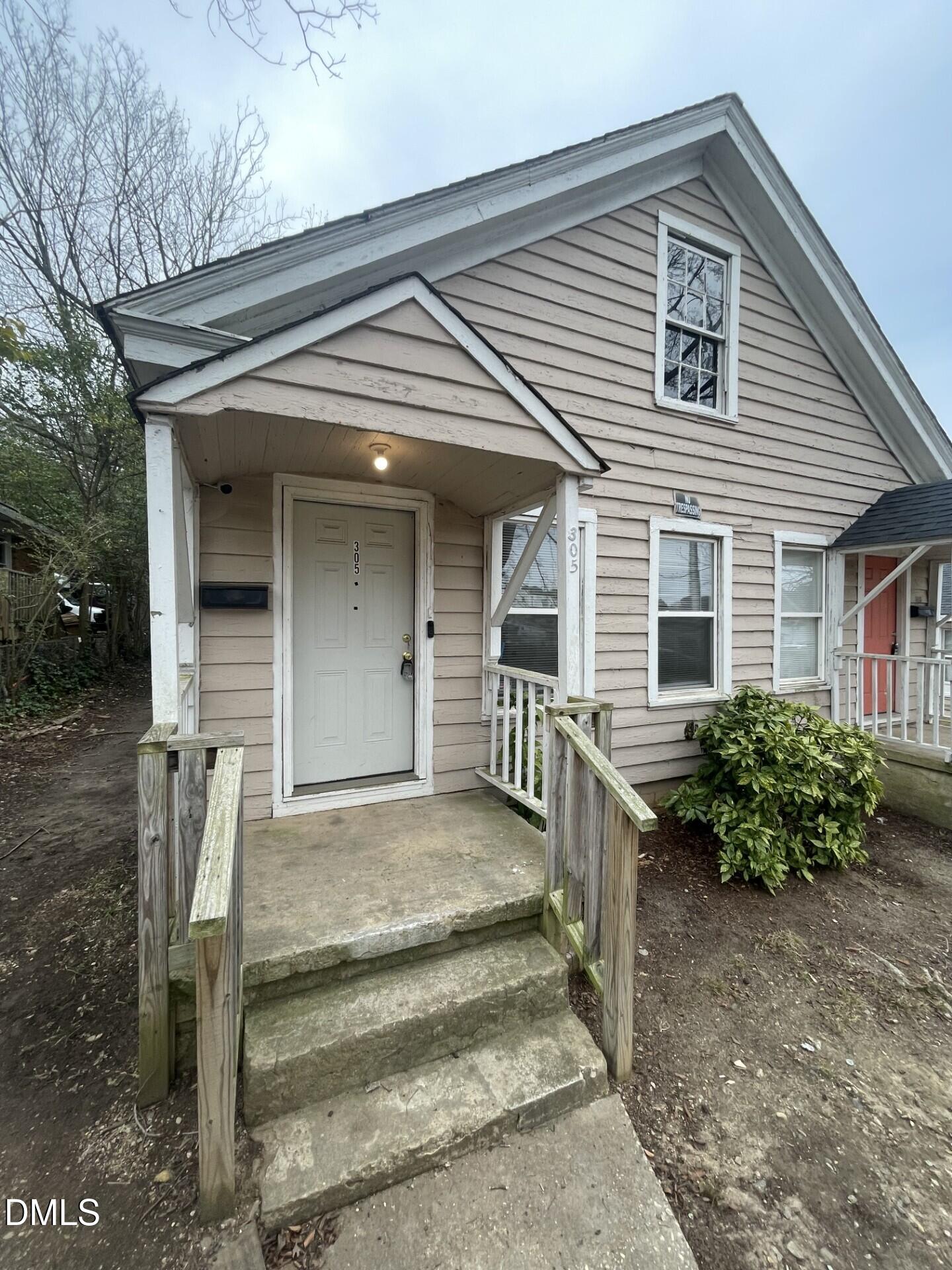 305 Kennedy Street Raleigh, NC 27610 - Photo 2 of 13 front view of a house with a small yard