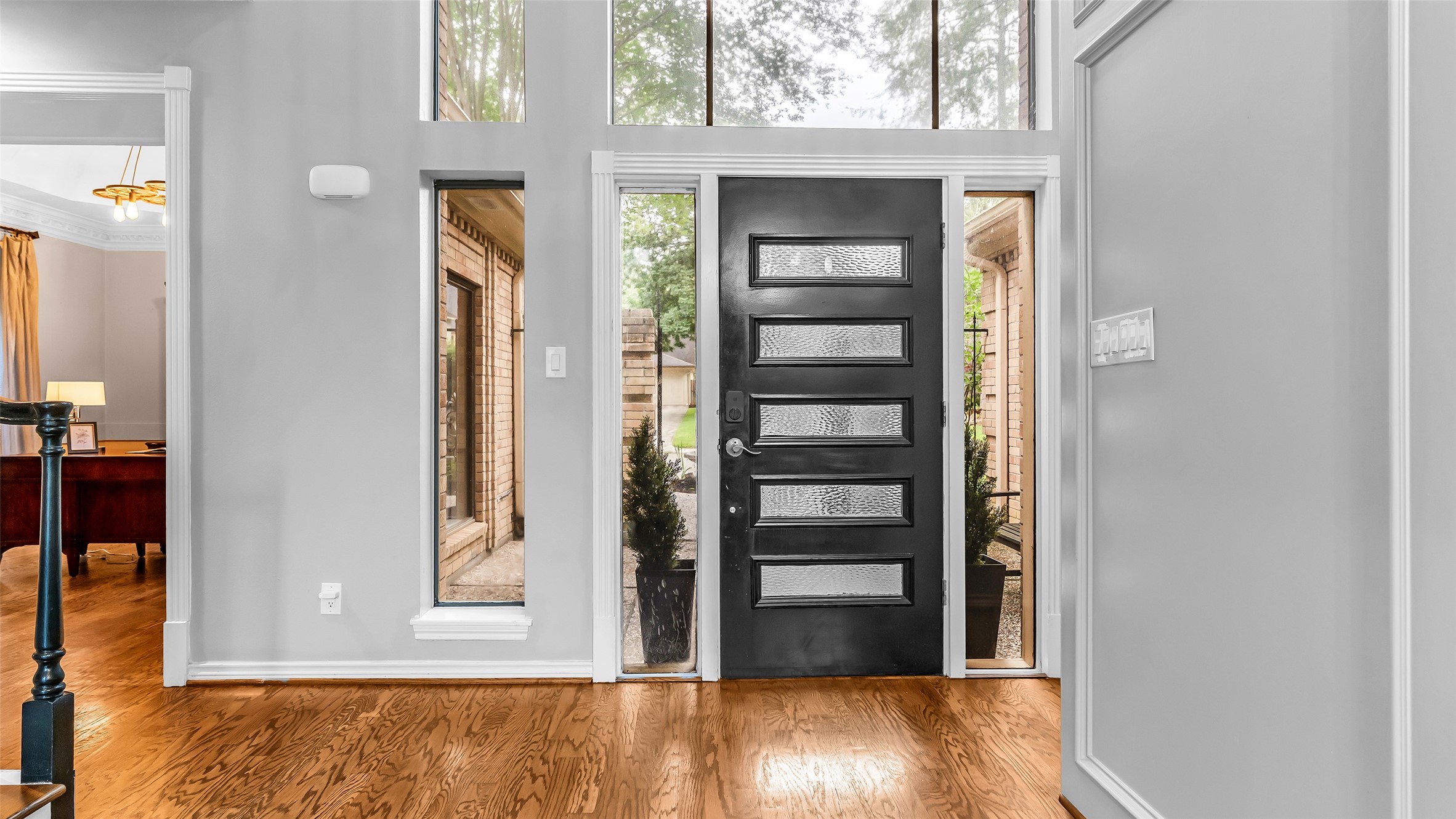 2607 Laurel Ridge Drive Houston, TX 77345 - Photo 7 of 47 hallway view with wooden floor and front door