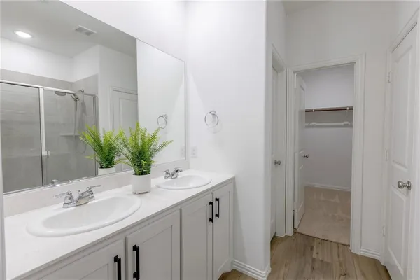 a bathroom with a sink a vanity and a mirror