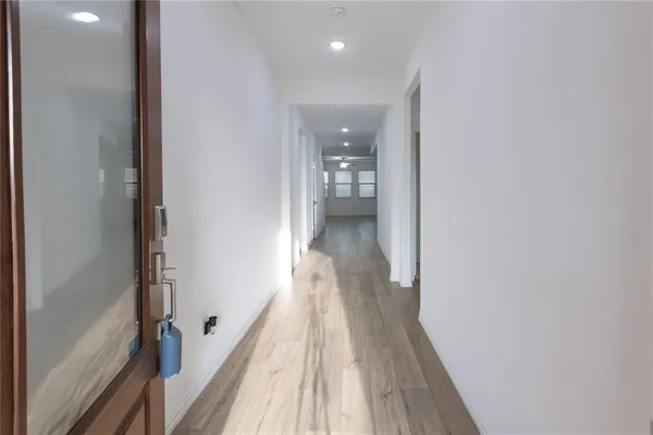 a view of a bathroom from the hallway