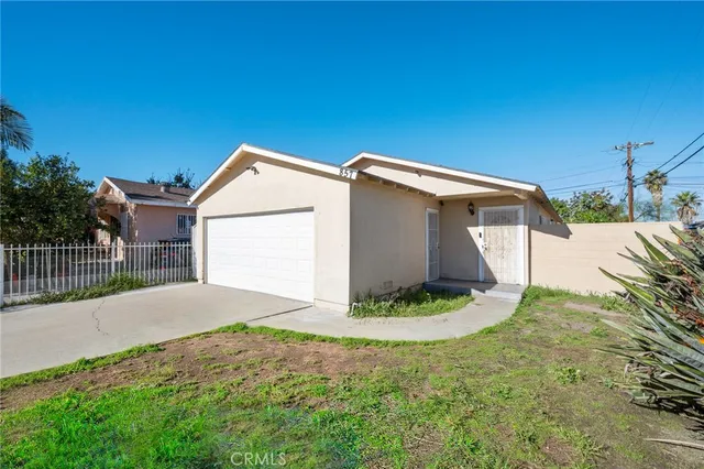 a backyard of a house with a yard and garage