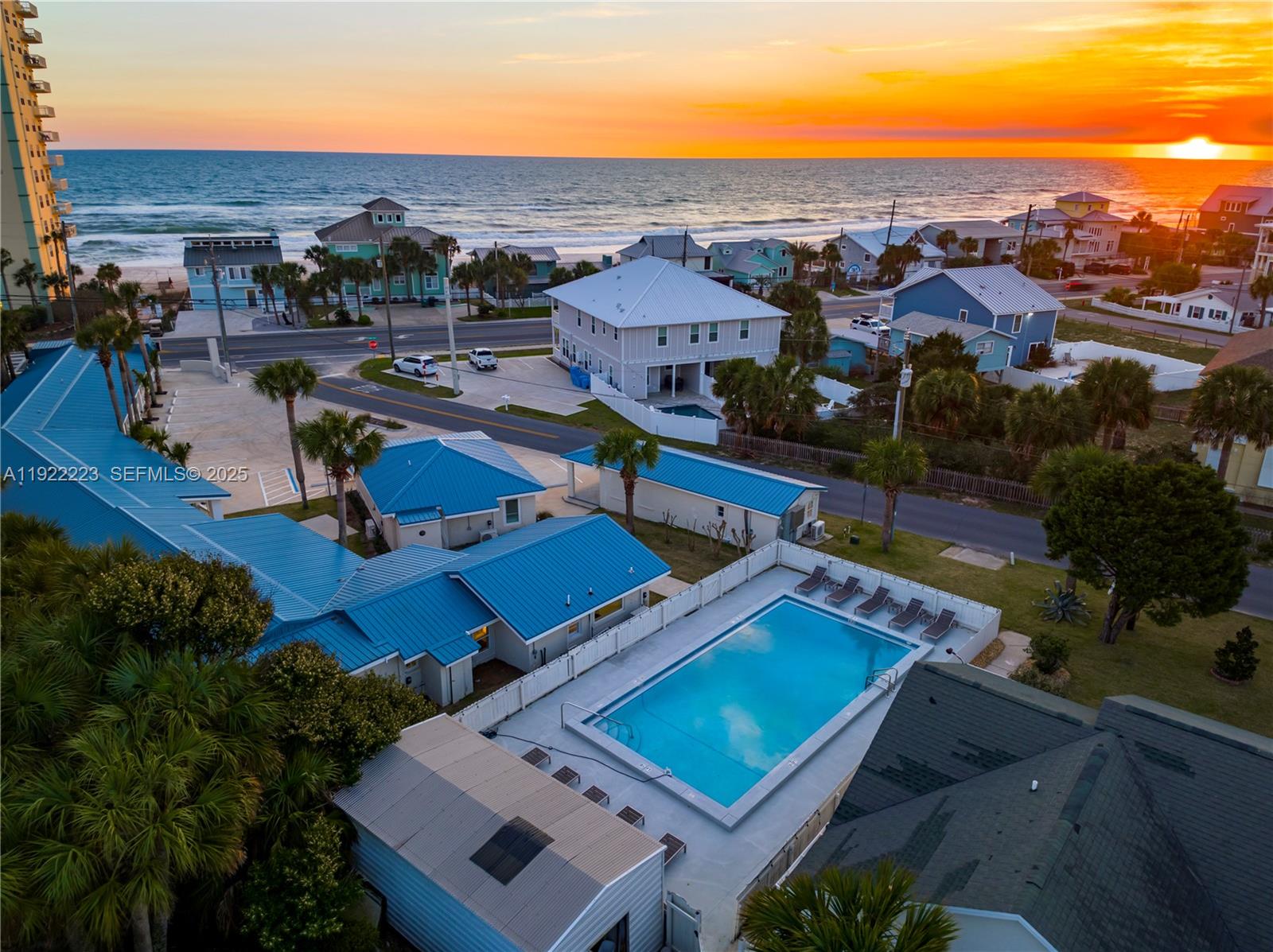17784 Front Beach Road, Unit 10 Panama City, FL 32413 - Photo 1 of 12 an aerial view of residential houses with outdoor space