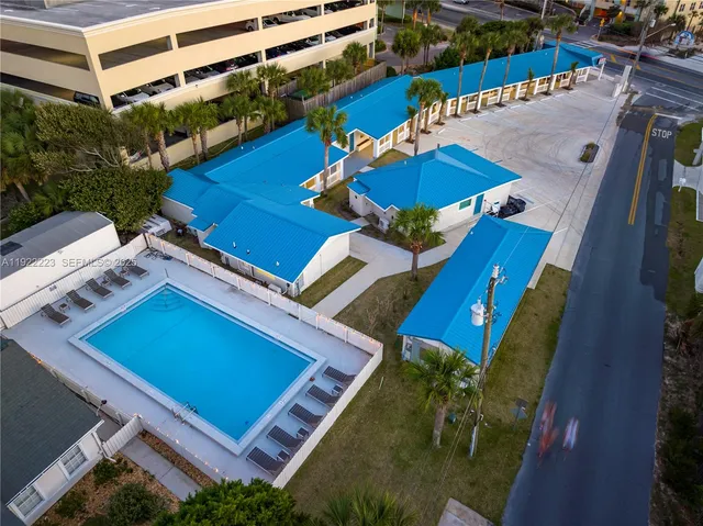 a view of swimming pool with outdoor seating