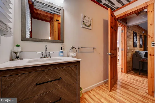 a view of a balcony with door and a mirror